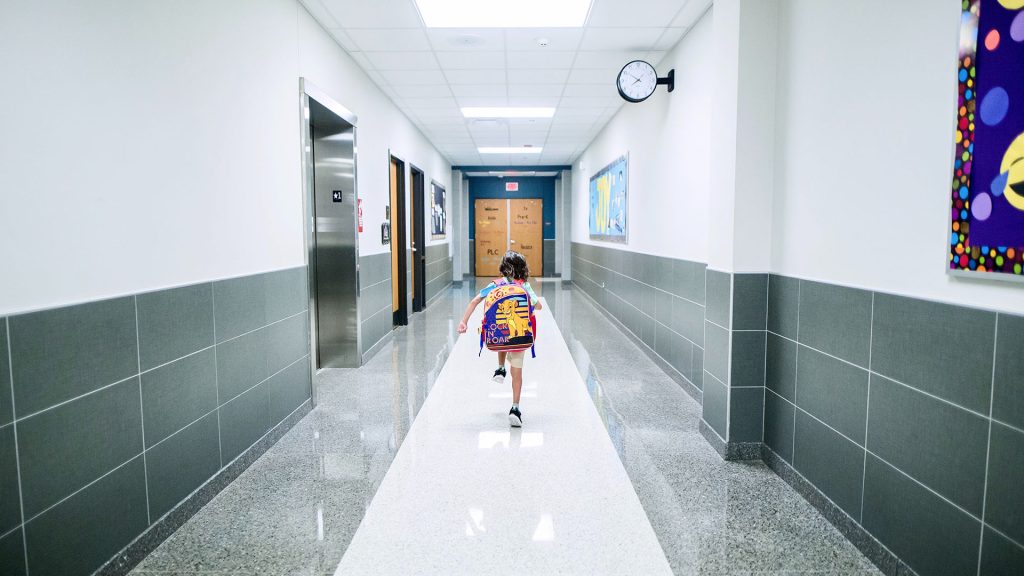 Young student in school hallway