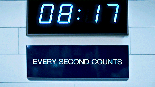 Clock with a sign underneath that says every second counts.